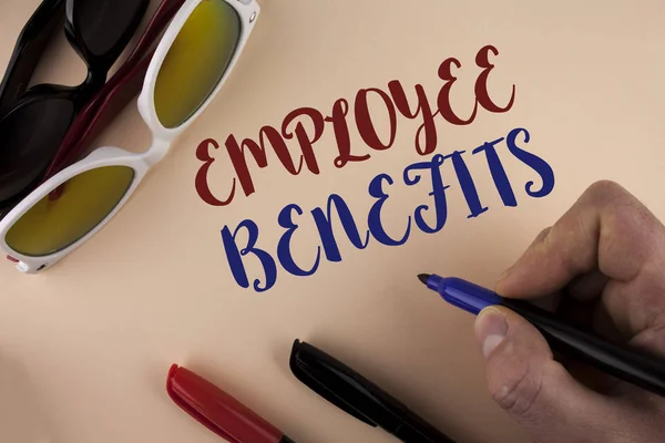 Text sign showing Employee Benefits. Conceptual photo list of advantage recruiter get at work Insurance written by Man on plain background holding Marker Sun Glasses and Markers next to it
