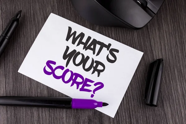 Handwriting text writing What Is Your Score Question. Concept meaning Tell Personal Individual Rating Average Results written on White Sticky Note Paper on the wooden background Mouse Markers