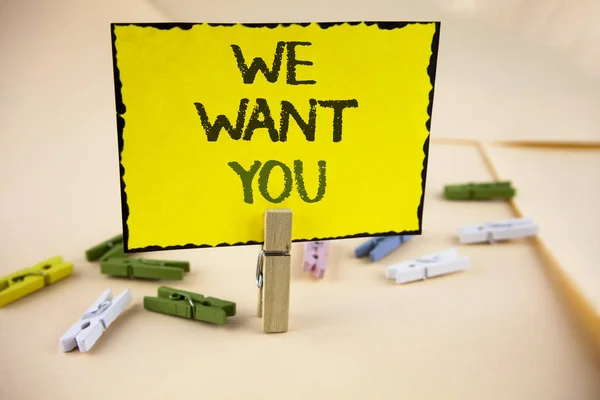 Writing note showing  We Want You. Business photo showcasing Employee Help Wanted Workers Recruitment Headhunting Employment written on Yellow Sticky Note Paper on plain background Wooden Clips.