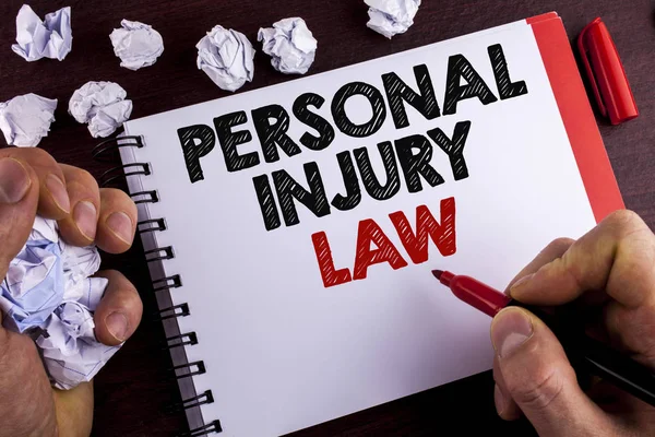 Conceptual hand writing showing Personal Injury Law. Business photo text guarantee your rights in case of hazards or risks written by Man on Notepad on wooden background Marker Paper Balls — Stock Photo, Image