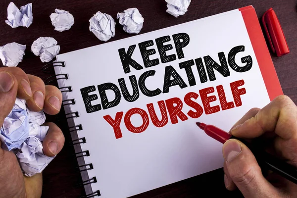 Conceptual hand writing showing Keep Education Yourself. Business photo text never stop learning to be better Improve encourage written by Man on Notepad on wooden background Marker Paper Balls — Stock Photo, Image