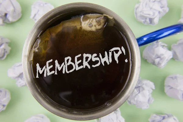 Text sign showing Membership. Conceptual photo Being member Part of a group or team Join organization company written on Black Tea in Cup within Crumpled Paper Balls on plain Green background.