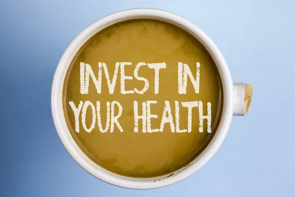 Text sign showing Invest In Your Health. Conceptual photo Spend money in personal healthcare Preventive Tests written on Coffee in a broken cup on the plain background.