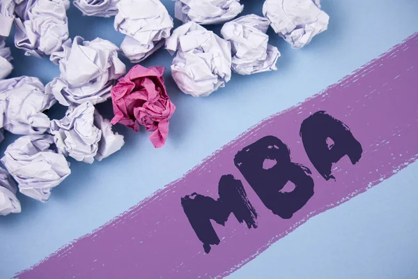 Word writing text Mba. Business concept for Master of Business Administration Advance Degree After College Studies written on Painted background Crumpled Paper Balls next to it.