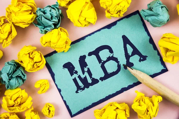 Text sign showing Mba. Conceptual photo Master of Business Administration Advance Degree After College Studies written on Sticky Note paper within Paper Balls on plain background Pencil.