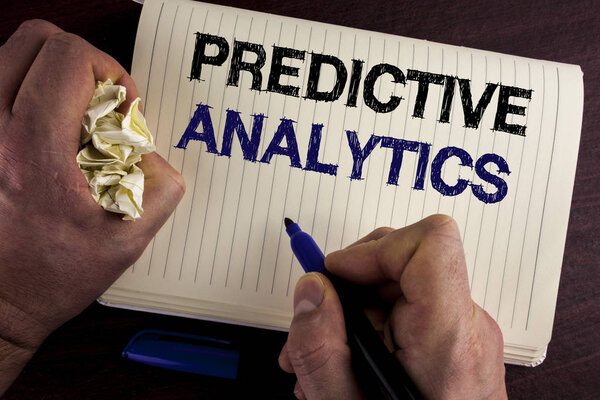 Writing note showing  Predictive Analytics. Business photo showcasing Method to forecast Performance Statistical Analysis written by Man on Notebook Book on wooden background Pen Crumpled Paper