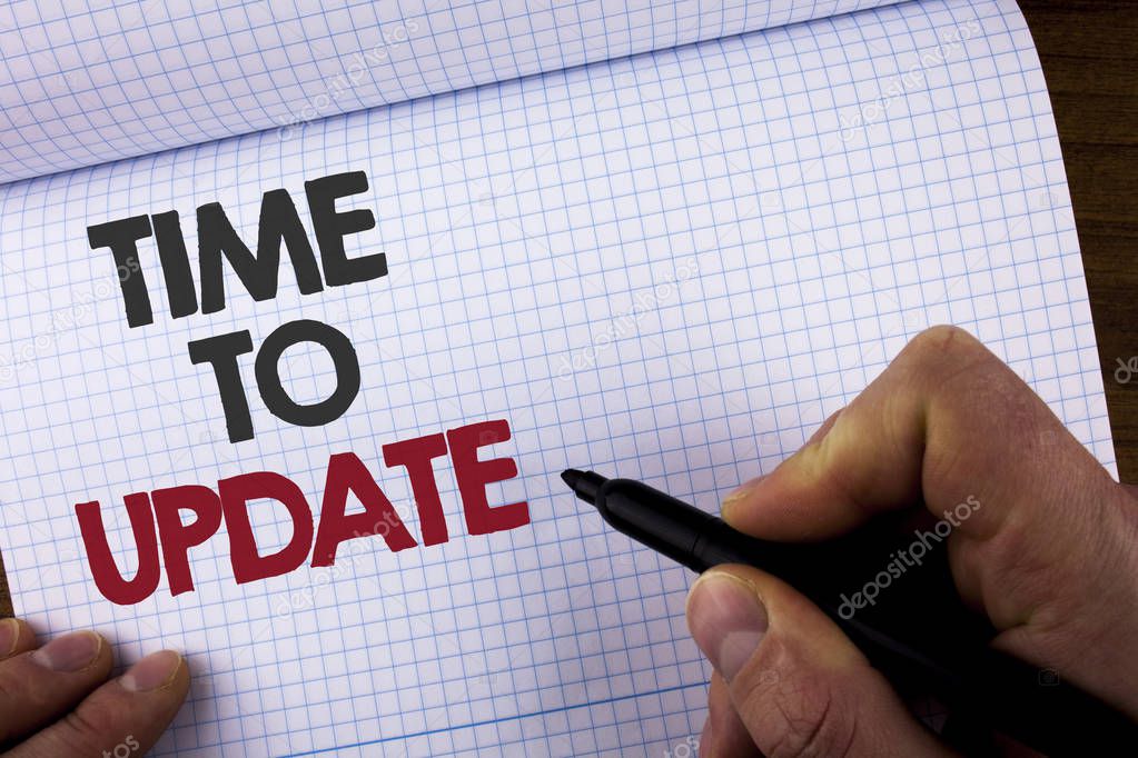 Writing note showing  Time To Update. Business photo showcasing Renewal Updating Changes needed Renovation Modernization written by Man on Notebook Book holding Marker on the wooden background