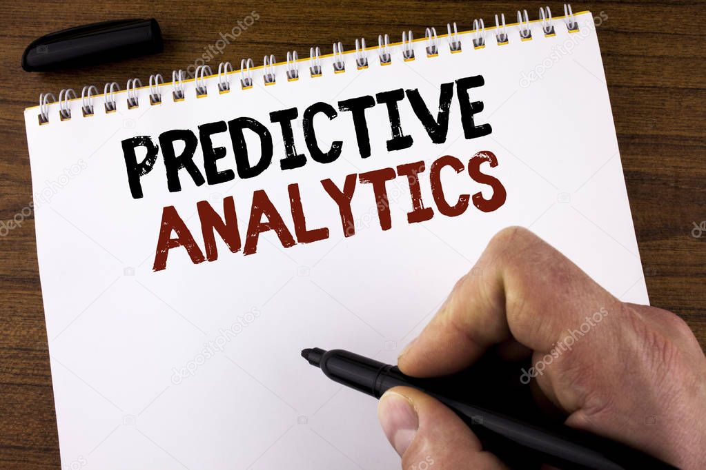 Word writing text Predictive Analytics. Business concept for Method to forecast Performance Statistical Analysis written by Man on Notepad holding Marker on the Wooden background.
