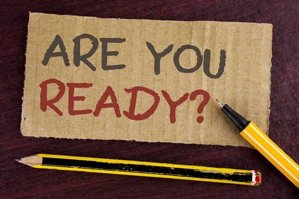 Text sign showing Are You Ready Question. Conceptual photo asking about availability Lets go out Study Work written on Cardboard Piece on wooden background Led Pen and Pencil next to it. — Stockfoto