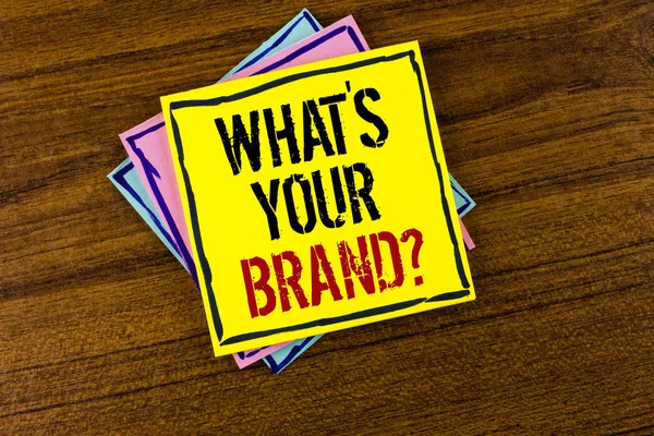 Writing note showing  What is Your Brand Question. Business photo showcasing asking about your company manufacturer or model written on Yellow Sticky Note Paper on the Wooden background. — Stock Photo, Image