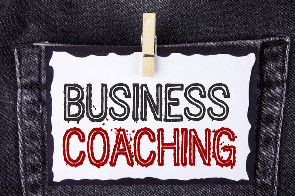 Word writing text Business Coaching. Business concept for consulting expert your field Experience improvement written on White Sticky Note Paper hanging with Clip on the Jeans background.
