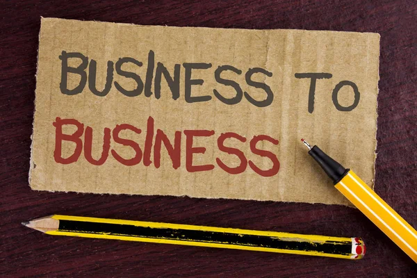 Text sign showing Business To Business. Conceptual photo Working ground businessman busy work hard stop playing written on Cardboard Piece on wooden background Led Pen and Pencil next to it. — Stock Photo, Image
