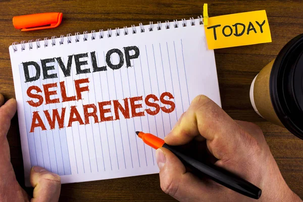 Text sign showing Develop Self Awareness. Conceptual photo improve your Informations about surrounding events written by Man on Notepad holding Marker on Wooden background Today Cup and Clip. — Stock Photo, Image