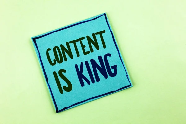 Conceptual hand writing showing Content Is King. Business photo showcasing articles or posts can guarantee you success Advertising written on Sticky Note Paper on the plain background.