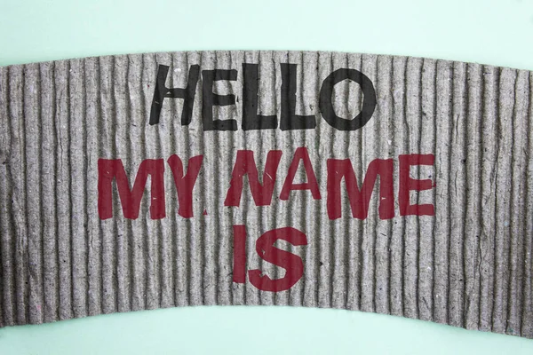 Handwriting text Hello My Name Is. Concept meaning meeting someone new Introduction Interview Presentation written on Cardboard piece on the plain background.