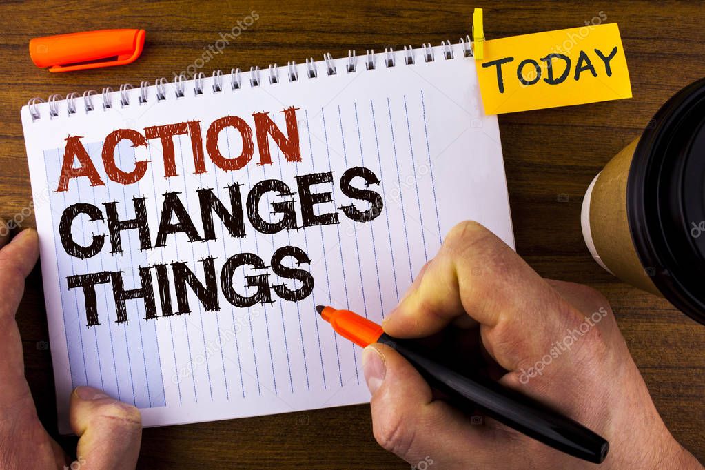 Text sign showing Action Changes Things. Conceptual photo doing something is like chain Improve Reflects written by Man on Notepad holding Marker on Wooden background Today Cup and Clip.