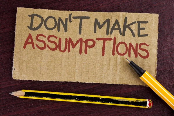 Text sign showing Do not Make Assumptions. Conceptual photo predict events future without clue Alternative Facts written on Cardboard Piece on wooden background Led Pen and Pencil next to it. — Stock Photo, Image