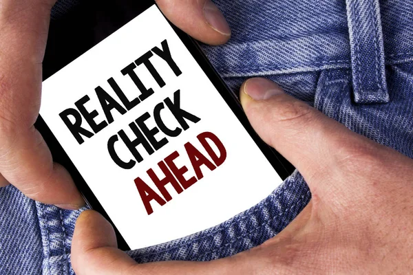 Word writing text Reality Check Ahead. Business concept for Unveil truth knowing actuality avoid being sceptical written on Mobile phone holding by man on the Jeans background. — Stock Photo, Image