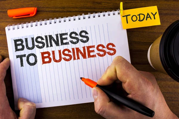 Text sign showing Business To Business. Conceptual photo Working ground businessman busy work hard stop playing written by Man on Notepad holding Marker on Wooden background Today Cup and Clip. — Stock Photo, Image