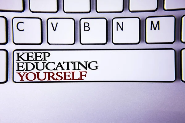 Writing note showing  Keep Education Yourself. Business photo showcasing never stop learning to be better Improve encourage written on white keyboard key with copy space Top view. — Stock Photo, Image