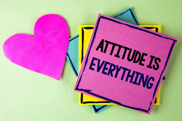 Writing note showing  Attitude Is Everything. Business photo showcasing Motivation Inspiration Optimism important to succeed written on Pink Sticky Note Paper on plain background Heart next to it. — Stock Photo, Image