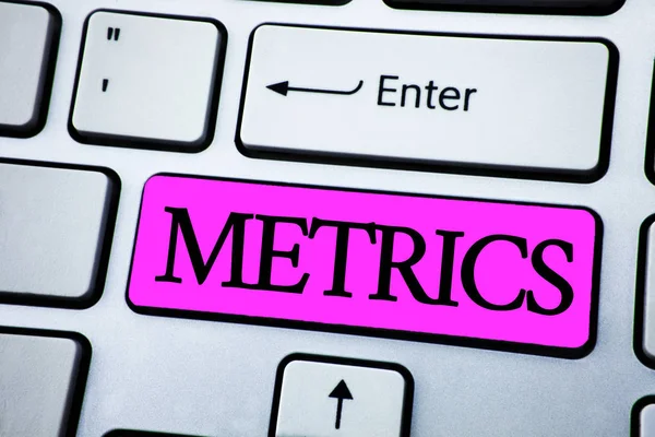 Text sign showing Metrics. Conceptual photo Method of measuring something Study poetic meters Set of numbers written on Pink Key Button on White Keyboard with copy space. Top view. — Stock Photo, Image