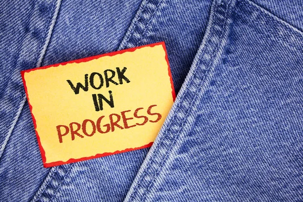 Writing note showing  Work In Progress. Business photo showcasing People is working right know to deliver expected results written on Sticky Note Paper on the Jeans background. — Stock Photo, Image