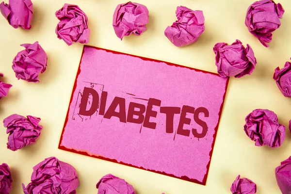 Writing note showing  Diabetes. Business photo showcasing Medical condition diagnosed with increased high level sugar written on Pink Sticky Note Paper on plain background Pink Paper Balls. — Stock Photo, Image