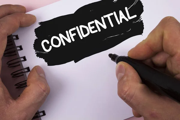Conceptual hand writing showing Confidential. Business photo text Agreements between two parties are private and protected written by Man on Painted Notepad on plain background Marker. — Stock Photo, Image