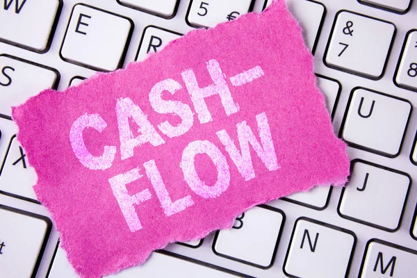 Conceptual hand writing showing Cash-Flow. Business photo showcasing Virtual movement of money by company finance department statistics written on Tear Sticky note paper placed on White Keyboard. — Stock Photo, Image