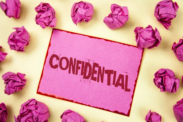 Writing note showing  Confidential. Business photo showcasing Agreements between two parties are private and protected written on Pink Sticky Note Paper on plain background Pink Paper Balls. — Stock Photo, Image