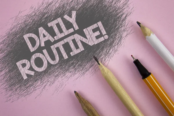Text sign showing Daily Routine Motivational Call. Conceptual photo Everyday good habits to bring changes written on Pink background Pen and pencils next to it.