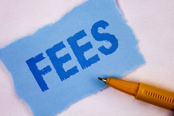 Text sign showing Fees. Conceptual photo Online creative agency charges product components hourly costs written on Tear Blue Sticky note paper on plain background Pen next to it.
