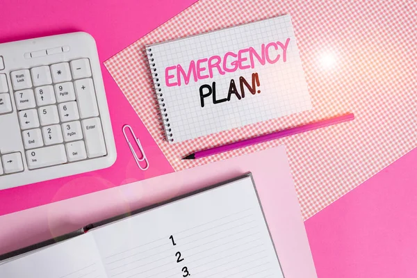 Writing note showing Emergency Plan. Business photo showcasing actions developed to mitigate damage of potential events Writing equipments and computer stuffs placed above colored plain table. — Stock Photo, Image