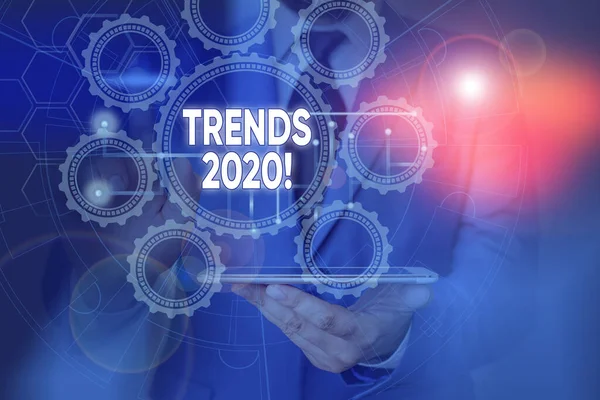 Scrittura a mano concettuale che mostra le tendenze 2020. Foto aziendali che mostrano la direzione generale in cui qualcosa si sta sviluppando o cambiando. Schema di rete di foto con il moderno dispositivo intelligente . — Foto Stock