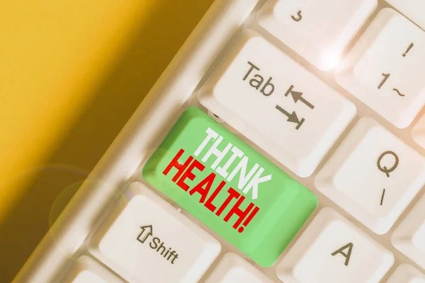 Schrijfbriefje met Denkgezondheid. Zakelijke foto presentatie staat van volledige fysieke mentale en sociale welzijn Witte pc toetsenbord met nota papier boven de witte achtergrond. — Stockfoto