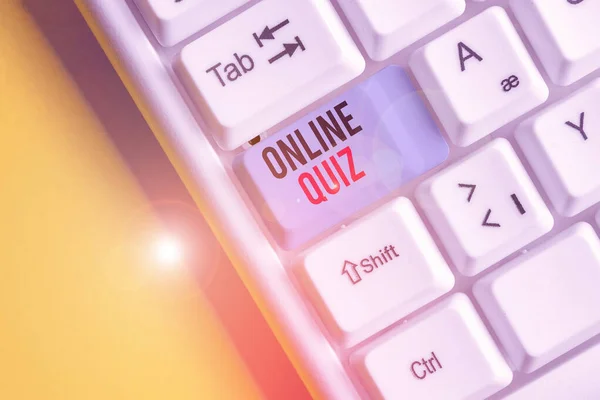 Handwriting text writing Online Quiz. Concept meaning game or a mind sport that are published on the Internet White pc keyboard with empty note paper above white background key copy space.