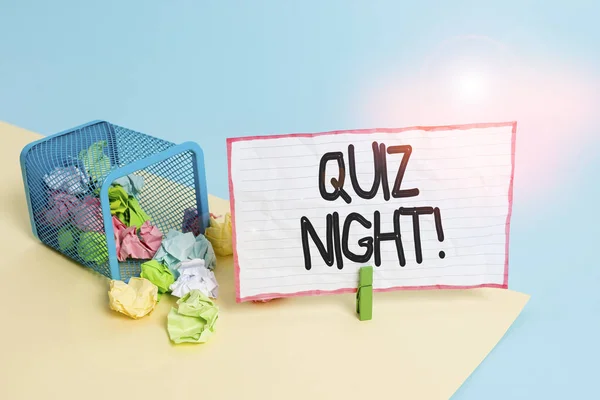 Conceptual hand writing showing Quiz Night. Business photo text evening test knowledge competition between individuals Trash bin crumpled paper clothespin reminder office supplies.