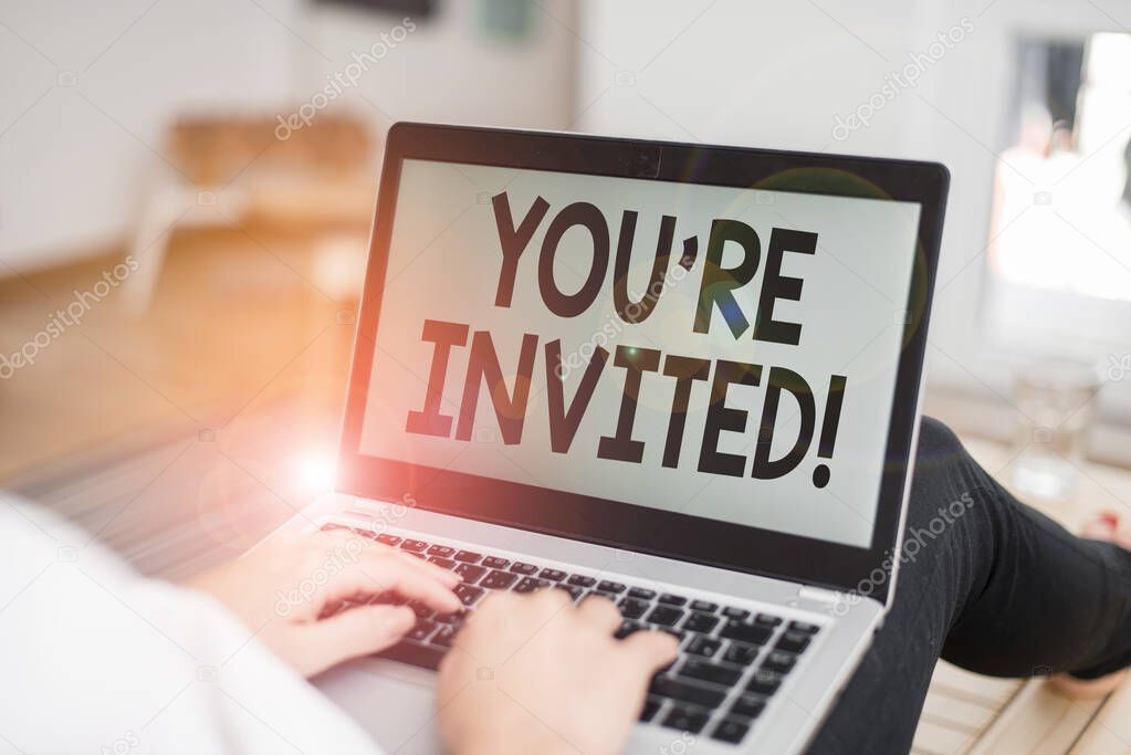 Text sign showing You Re Invited. Conceptual photo make a polite friendly request to someone go somewhere woman laptop computer office supplies technological devices inside home.