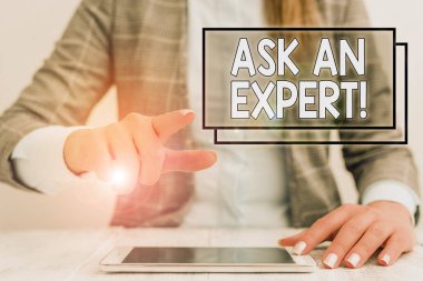Writing note showing Ask An Expert. Business photo showcasing confirmation that have read understand and agree with guidelines Business woman sitting with mobile phone on the table.