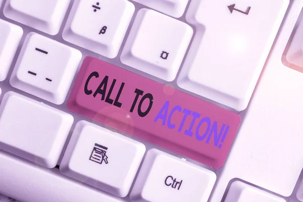 Conceptual hand writing showing Call To Action. Business photo showcasing exhortation do something in order achieve aim with problem White pc keyboard with note paper above the white background.