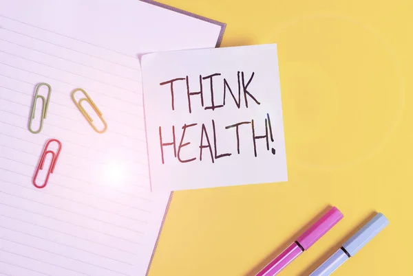 Testo di scrittura di parole Think Health. Concetto di business per uno stato di completo benessere fisico mentale e sociale Carta blu vuota con graffette e matite su tavolo giallo . — Foto Stock