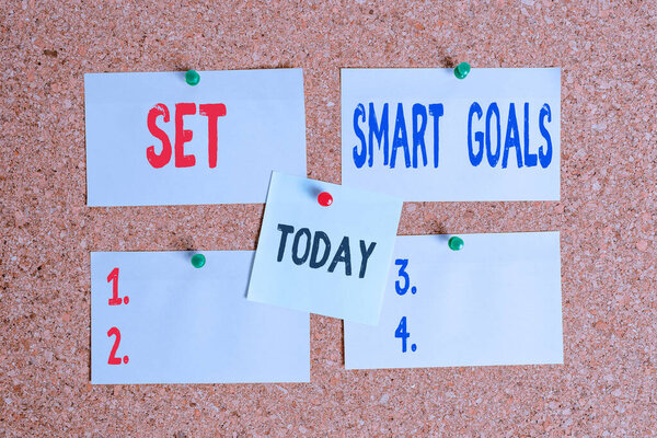 Text sign showing Set Smart Goals. Conceptual photo giving criteria to guide in the setting of objectives Corkboard color size paper pin thumbtack tack sheet billboard notice board.