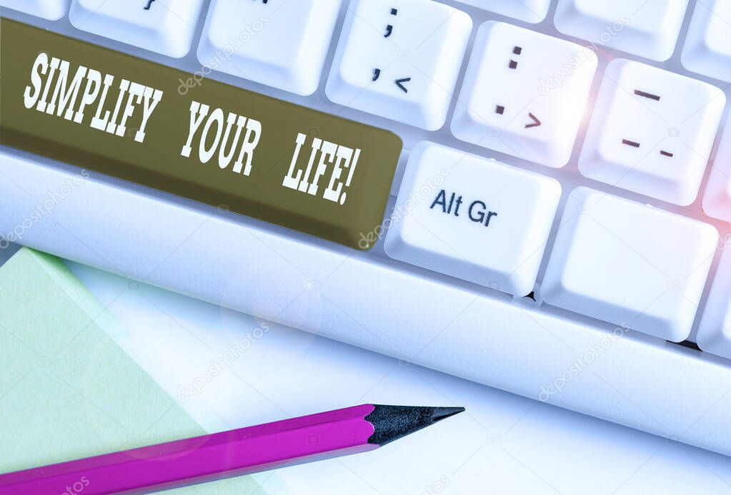 Text sign showing Simplify Your Life. Conceptual photo focused on important and let someone else worry about less ones White pc keyboard with empty note paper above white background key copy space.