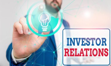 Writing note showing Investor Relations. Business photo showcasing analysisagement responsibility that integrates finance Male human wear formal suit presenting using smart device.