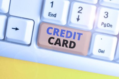 Word writing text Credit Card. Business concept for card that allows you to borrow money against a line of credit White pc keyboard with empty note paper above white background key copy space.