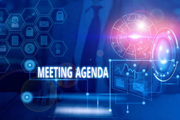 Handwriting text writing Meeting Agenda. Concept meaning items that participants hope to accomplish at a meeting Picture photo system network scheme modern technology smart device.