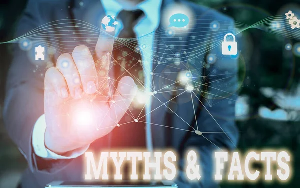 Writing note showing Myths And Facts. Business photo showcasing usually traditional story of ostensibly historical events Picture photo network scheme with modern smart device. — Stock Photo, Image