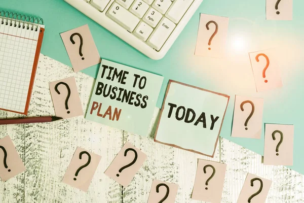 Conceptual hand writing showing Time To Business Plan. Business photo showcasing organizing schedule for work Marketing product Writing tools and scribbled paper on top of the wooden table.