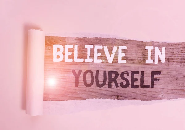 Handwriting text Believe In Yourself. Concept meaning common piece of advice that you can do everything Cardboard which is torn in the middle placed above a wooden classic table. — Stock Photo, Image